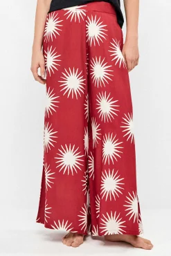 Calça comprida perna larga com estampado de sóis