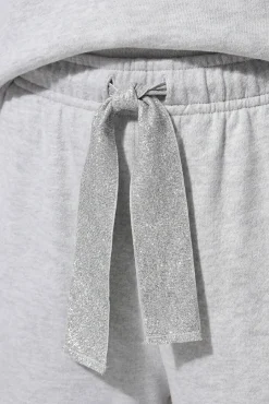 Calça desportiva com detalhe lurex