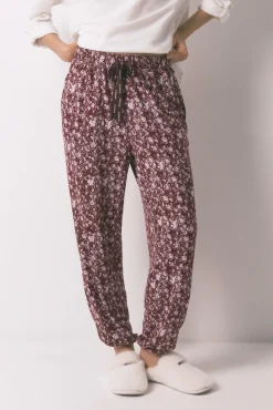 Calças compridas estampado de flores bordô
