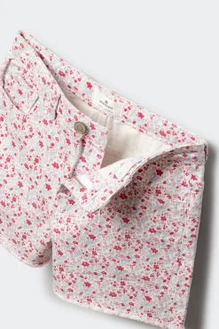 Calções em sarja com estampado de flores para menina