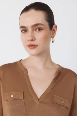 Camiseta com bolsos