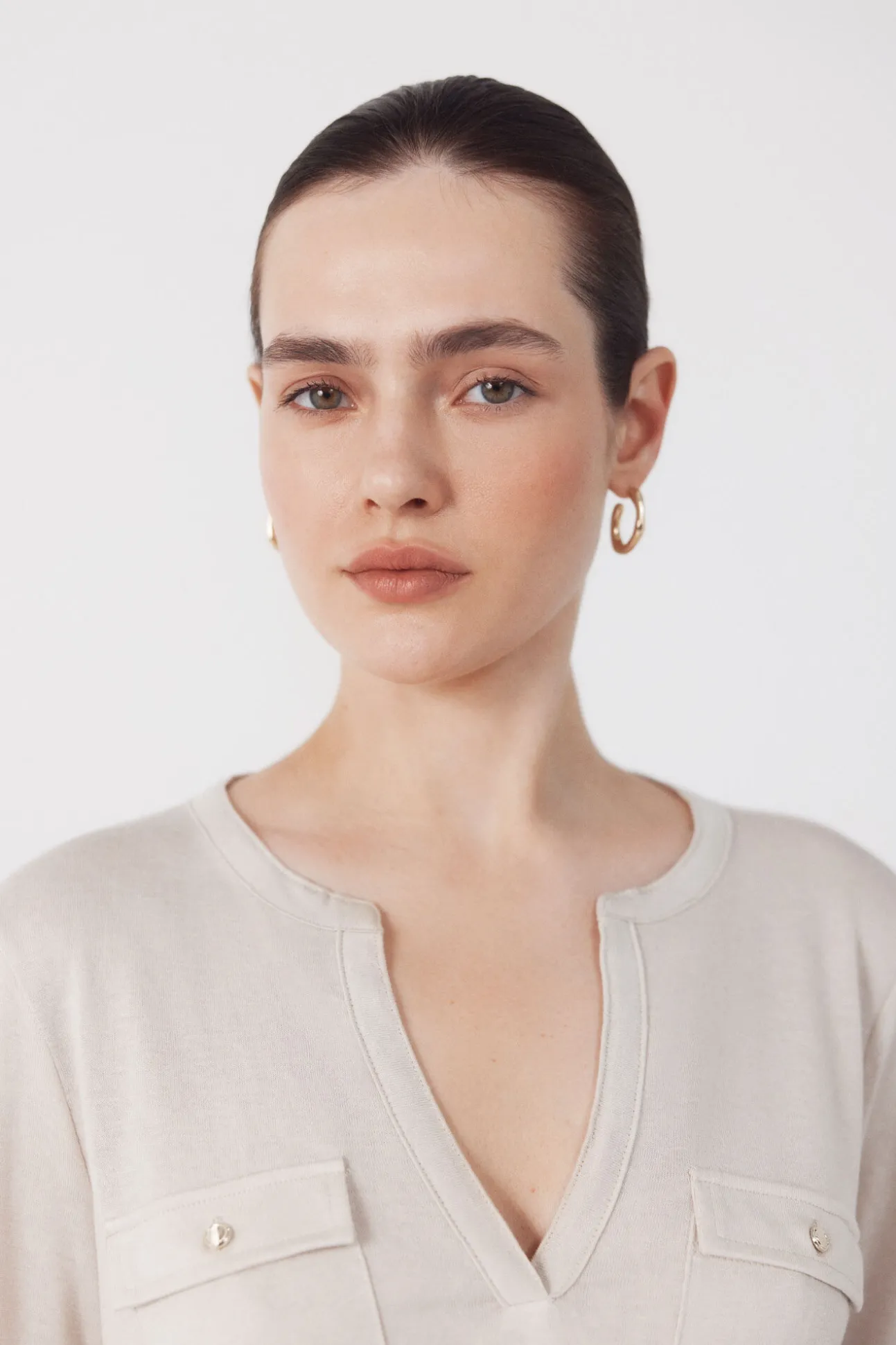 Camiseta com bolsos