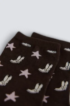 Meias compridas com botas e estrelas